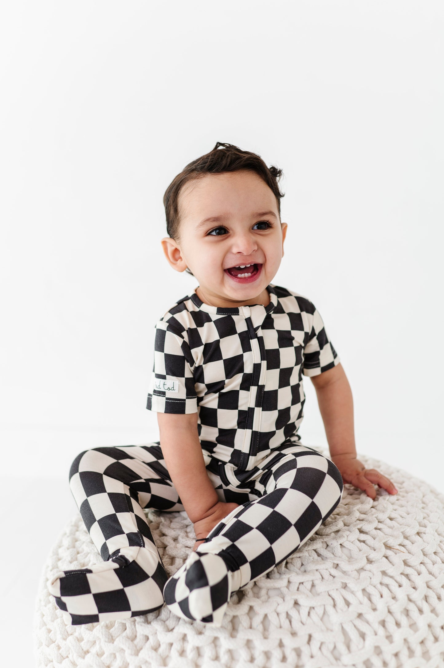 BAMBOO - BLACK CHECKERED SHORT SLEEVE ONESIE